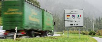 
A sign on a street refers to the truck toll requirement in Germany